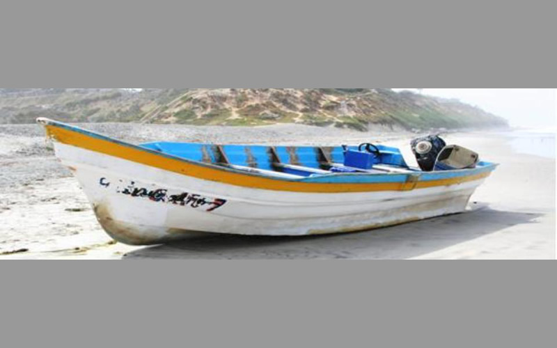 an abandoned panga-style smuggling boat
